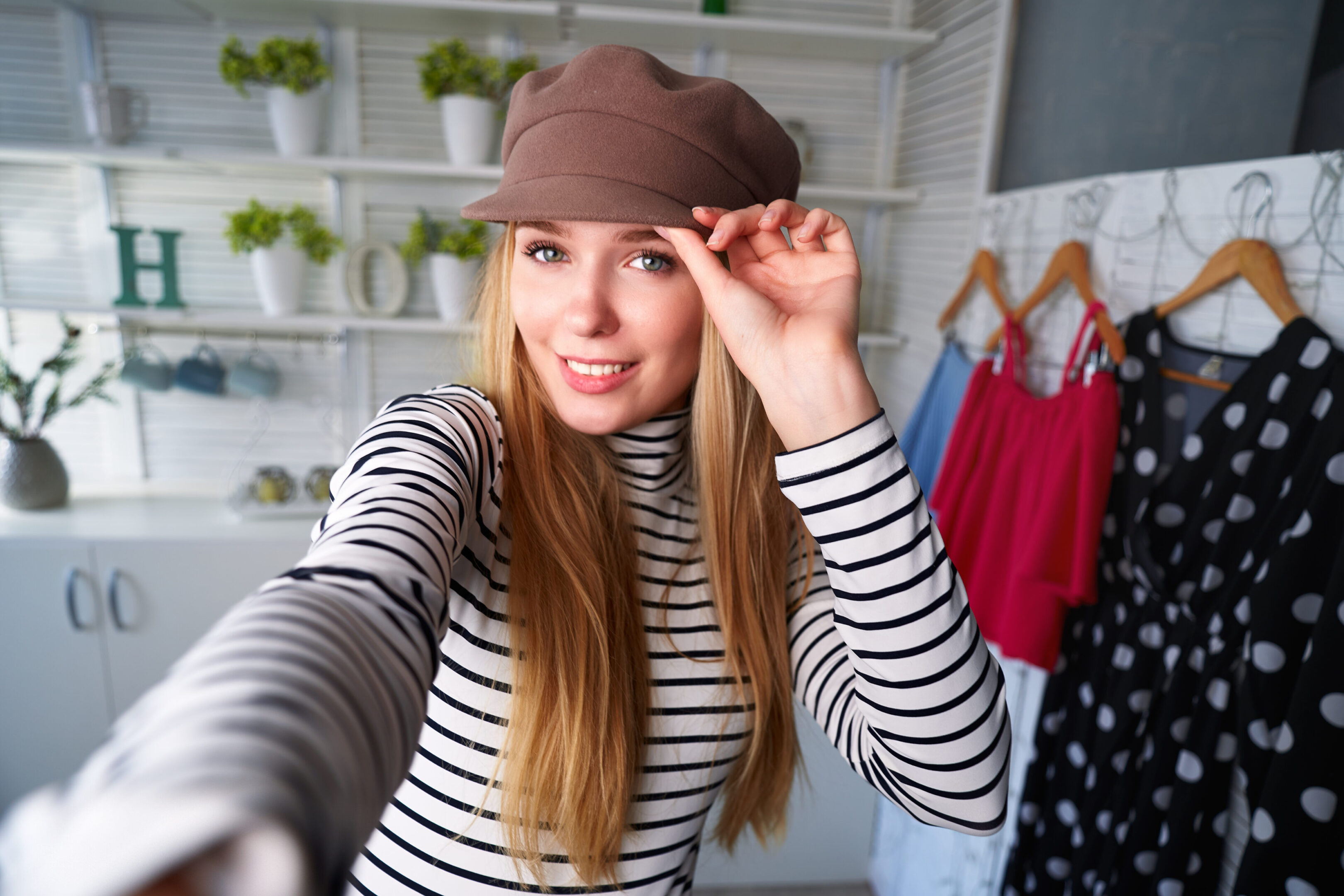 Fashion,Blogger,Woman,In,Jeans,And,Turtleneck,Showing,Fashionable,Caps