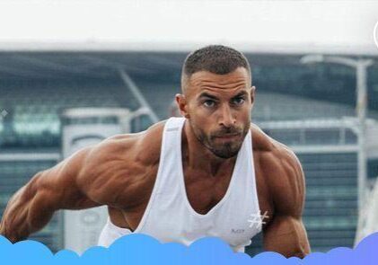 Man exercising outdoors in a white tank.