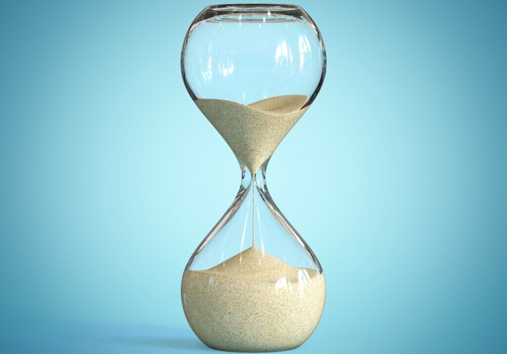 Hourglass on blue background, sandglass 3d rendering isolated illustration