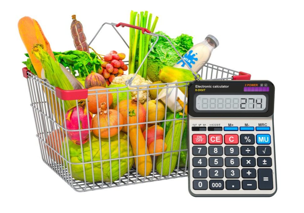Shopping basket full of products with calculator, 3D rendering isolated on white background